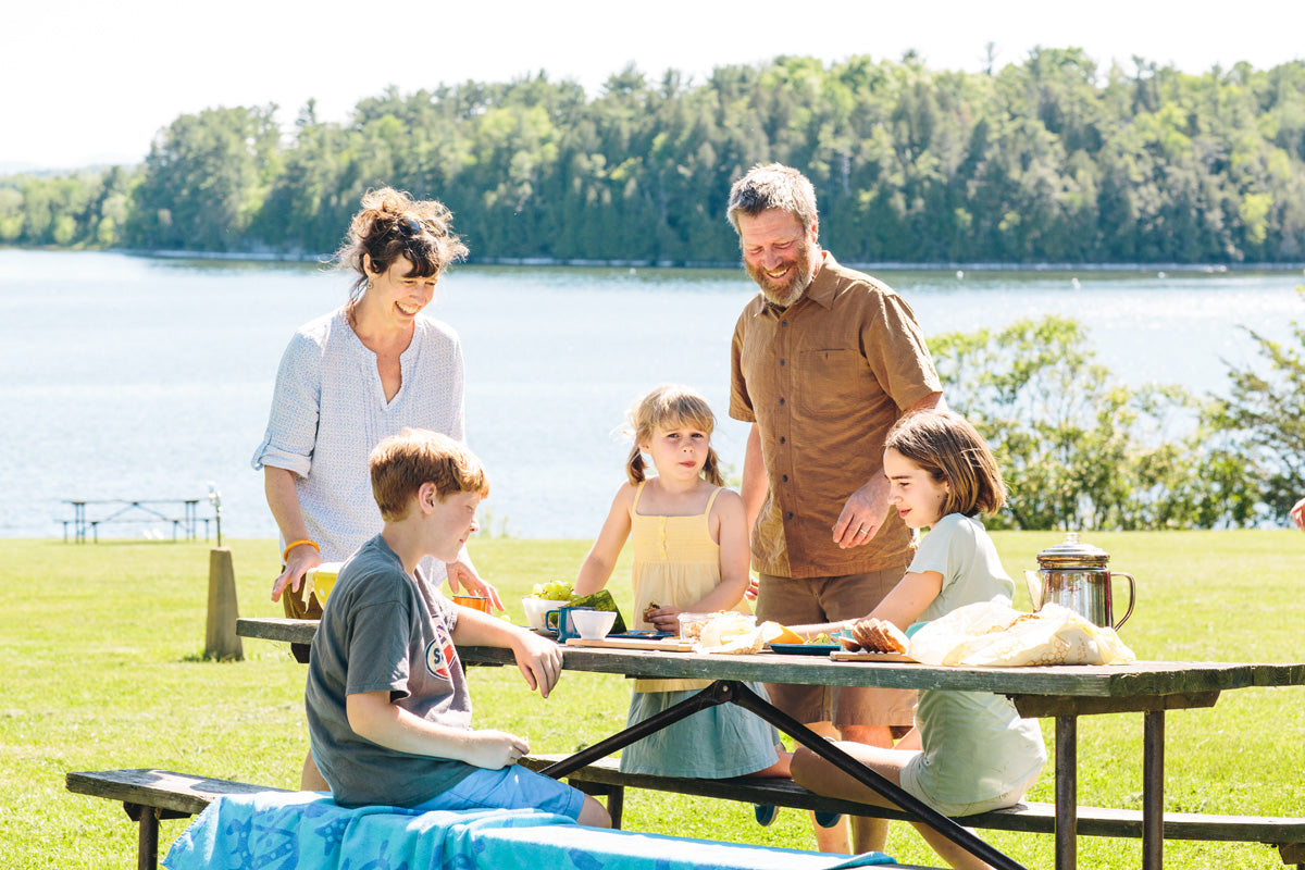 Bee's Wrap founder Sarah Kaeck with children and table with food and bee's wrap products